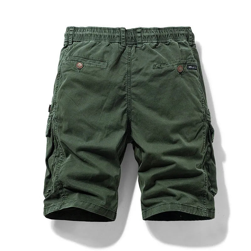 Men's army green cotton shorts with a zip fly and multiple pockets, shown in a Korean-style fifth pants length.