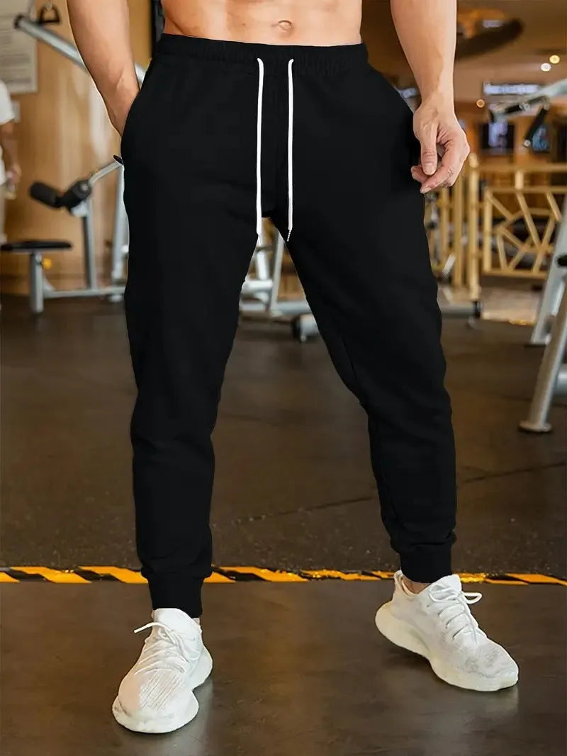 Men's linen-style leisure trousers with elastic drawstring waistband and loose fit design