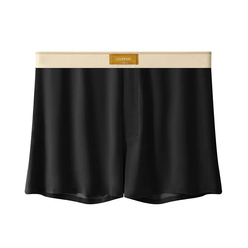Pack of three men's solid colour loose fit ice silk underwear briefs on a grey background.