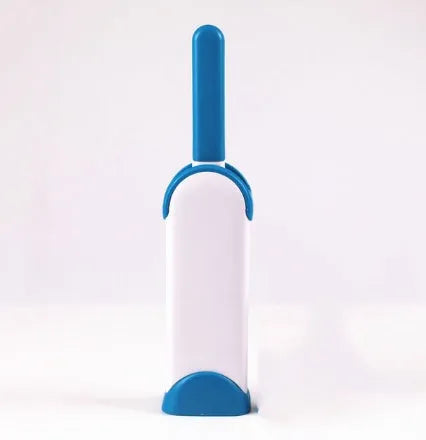 Blue reusable pet hair removal comb with a double-sided sticky brush and self-cleaning base.