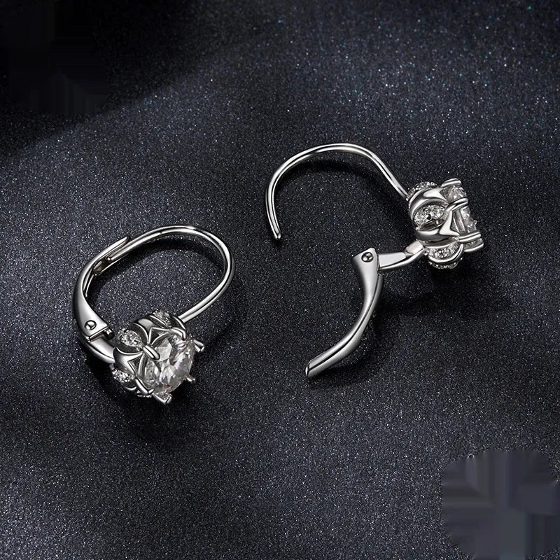 Sterling silver flower bud ear clip earrings with white gold plating and moissanite stone