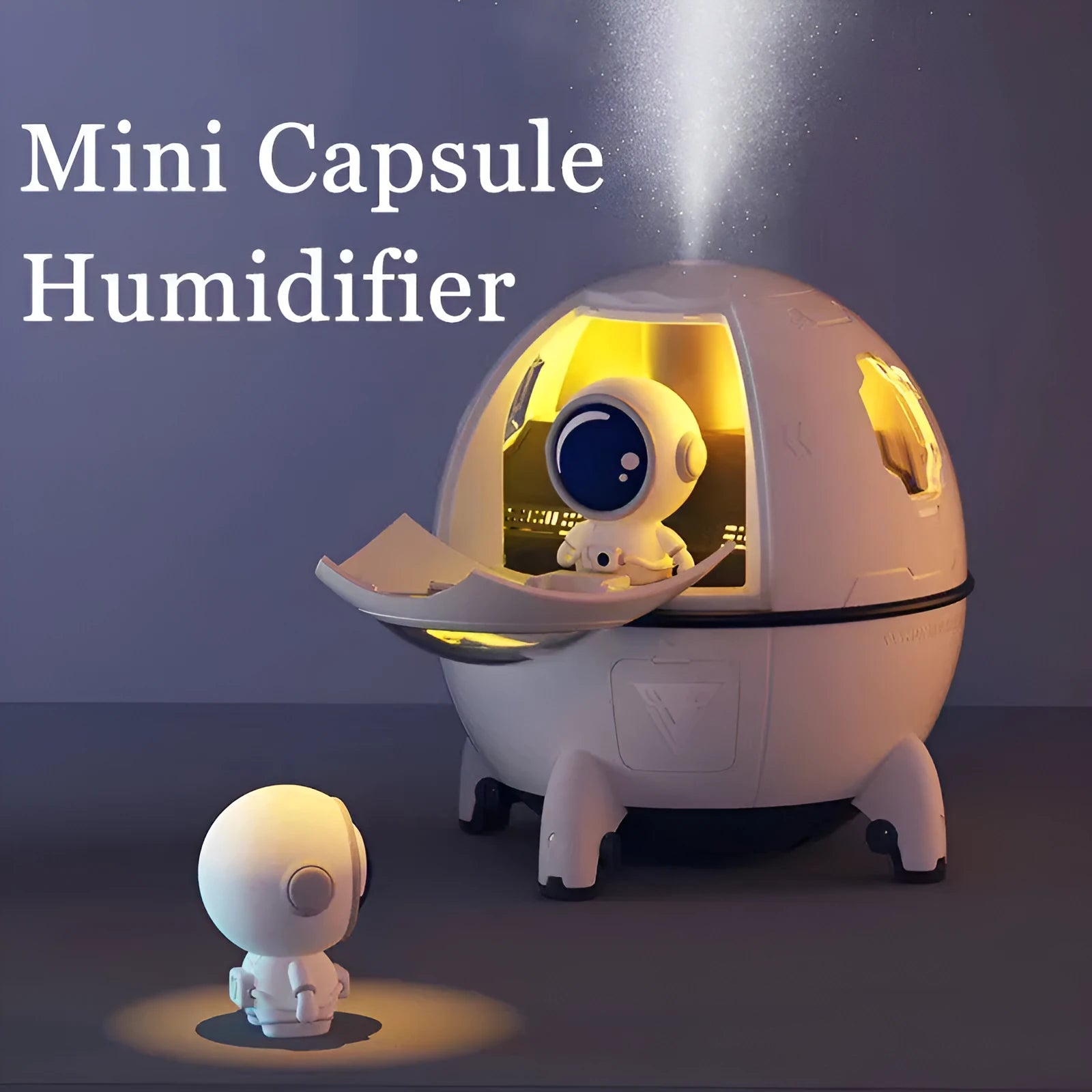 Purple astronaut-shaped USB desktop humidifier with LED light on a desk next to a laptop.