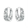 Sterling silver hollow butterfly earrings with zircon accents on white background