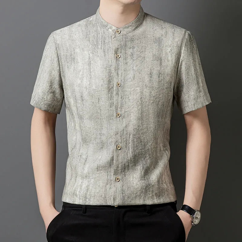 Men's loose grey linen cardigan shirt with a stand collar on a hanger.