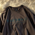 Cotton loose fit short sleeve t-shirt with letters print in black, shown on a model.