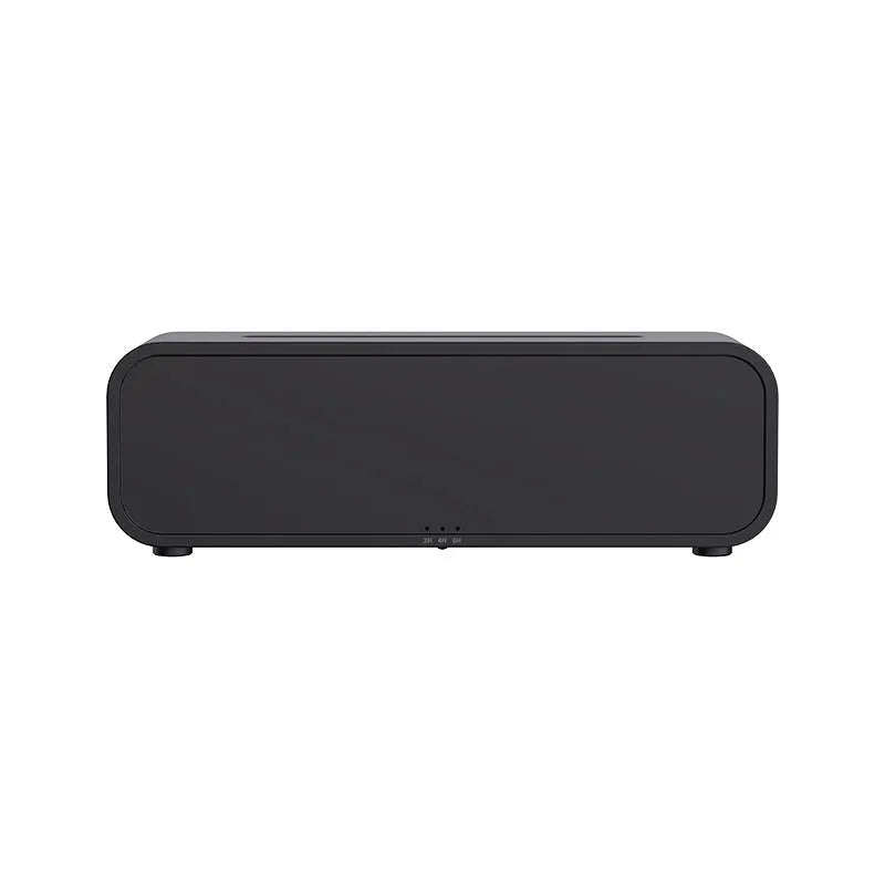 Black and white USB essential oil aroma diffuser with colour-changing light and remote control on a desk