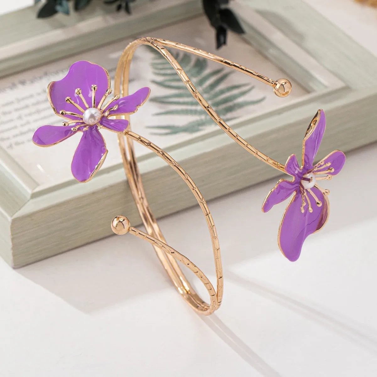Patterned hollow armband bracelet with linear design in pink and purple colour options