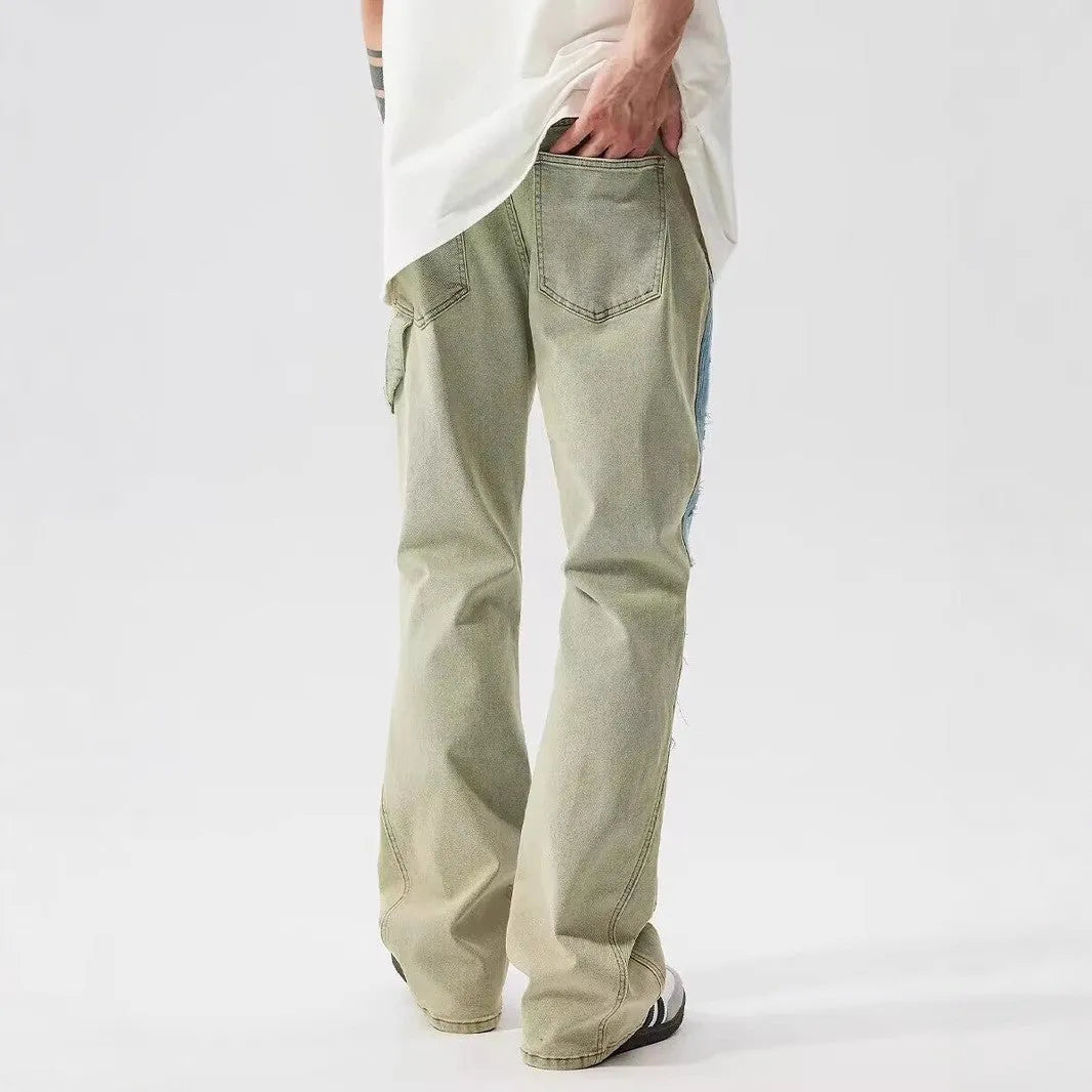 Men's yellow and blue patchwork distressed jeans with splash-ink design detail