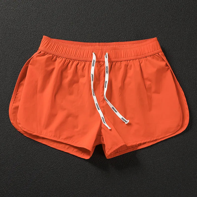 Men's loose beach surfing shorts in quick-dry polyester available in orange, green, and black