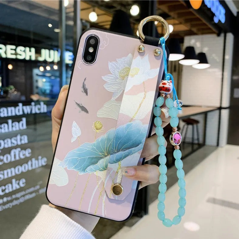 Rose floral patterned phone case with a wrist strap attachment point for iPhone.