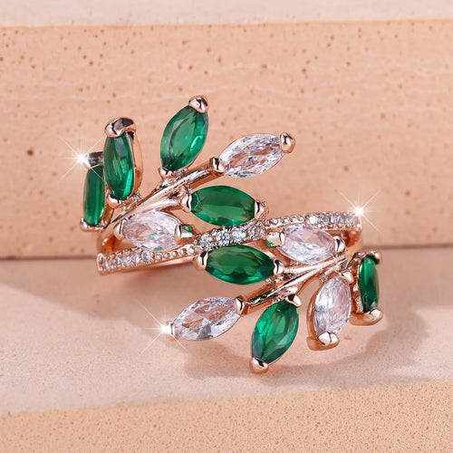 Adjustable horse eye zircon leaf ring in copper on a hand, showing leaf detail and colour options.