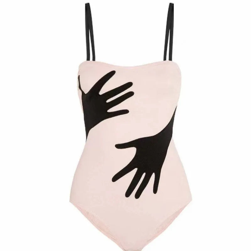 Women's one-piece bikini swimsuit with a light gauze skirt attached, shown on a model.