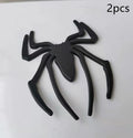 Three-dimensional metal spider bumper sticker in zinc alloy, shown in gold colour.