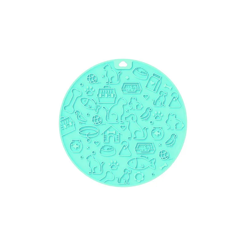 Round blue silicone pet lick mat with suction cup base on a kitchen counter