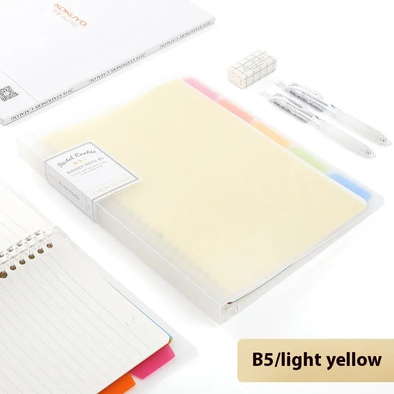 Refillable loose-leaf spiral notebook with PP cover open, showing raw wood pulp paper in grid ruling.