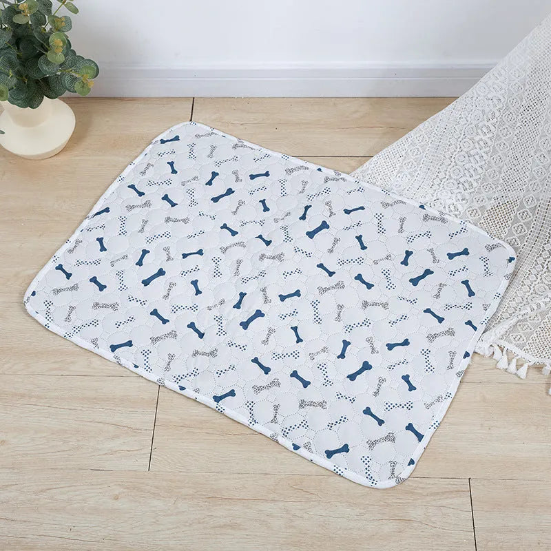 Reusable washable pet urine pad with animal print design and waterproof layer.
