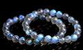 Natural cream body crystal bracelet with spherical beads on a wrist, showing minimalist unisex design.