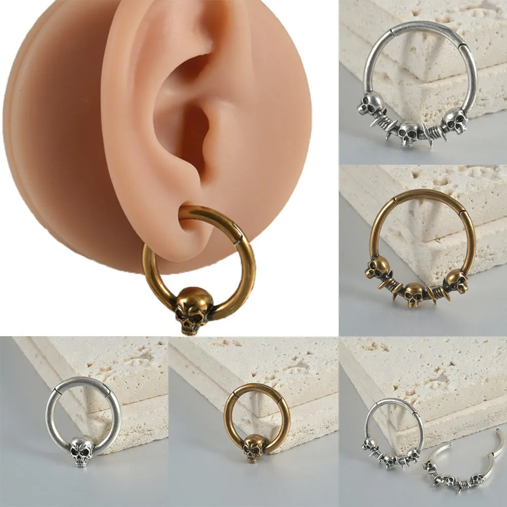 Copper punk earrings with ghost head designs in antique silver or ancient gold finishes