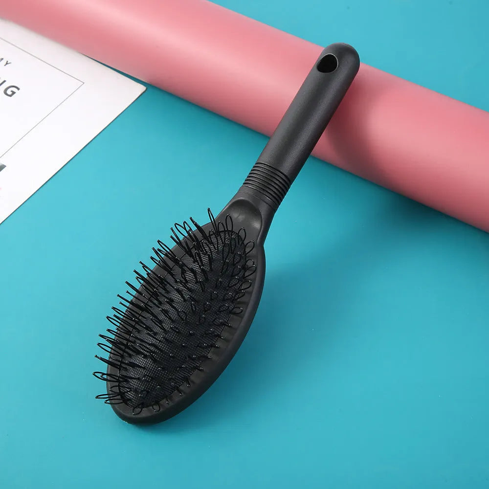 Black or pink plastic ring tooth hair extension comb with airbag cushion measuring 22x6cm