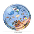 Large square blue water sensory playmat for cats on a floor, showing floating fish toys inside.