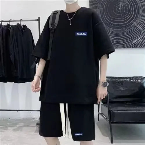 Waffle-textured cotton blend leisure sports suit set with short sleeve top and shorts.