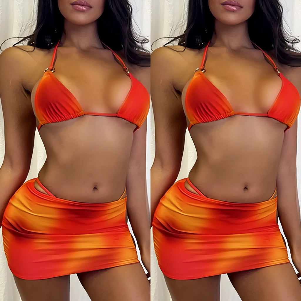 Tie-dye gradient three-piece halter bikini swimsuit set with skirt on a mannequin.