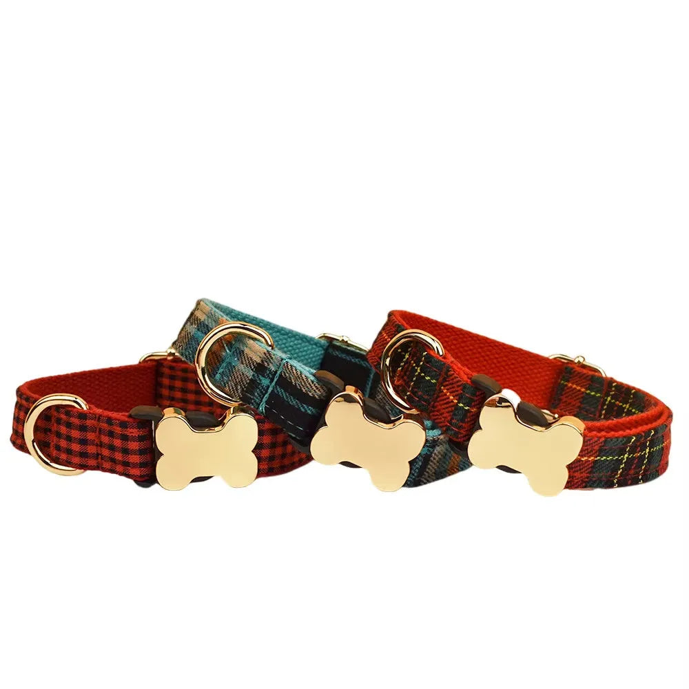 Flat nylon dog collar with grey grid print and a white bone-shaped plastic buckle.
