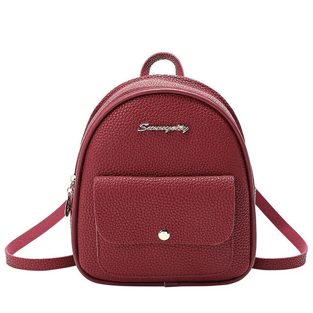 Women's black PU backpack purse with letter design and shoulder strap showing compact 18.5cm length