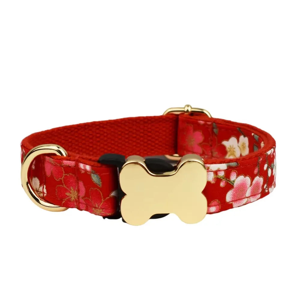 Flat nylon dog collar with grey grid print and a white bone-shaped plastic buckle.