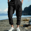 Men's linen casual trousers with ankle-tied cuffs and multiple pockets in loose fit