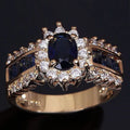Personalised zinc alloy fashion ring with diamond and blue or purple zircon stone designs.