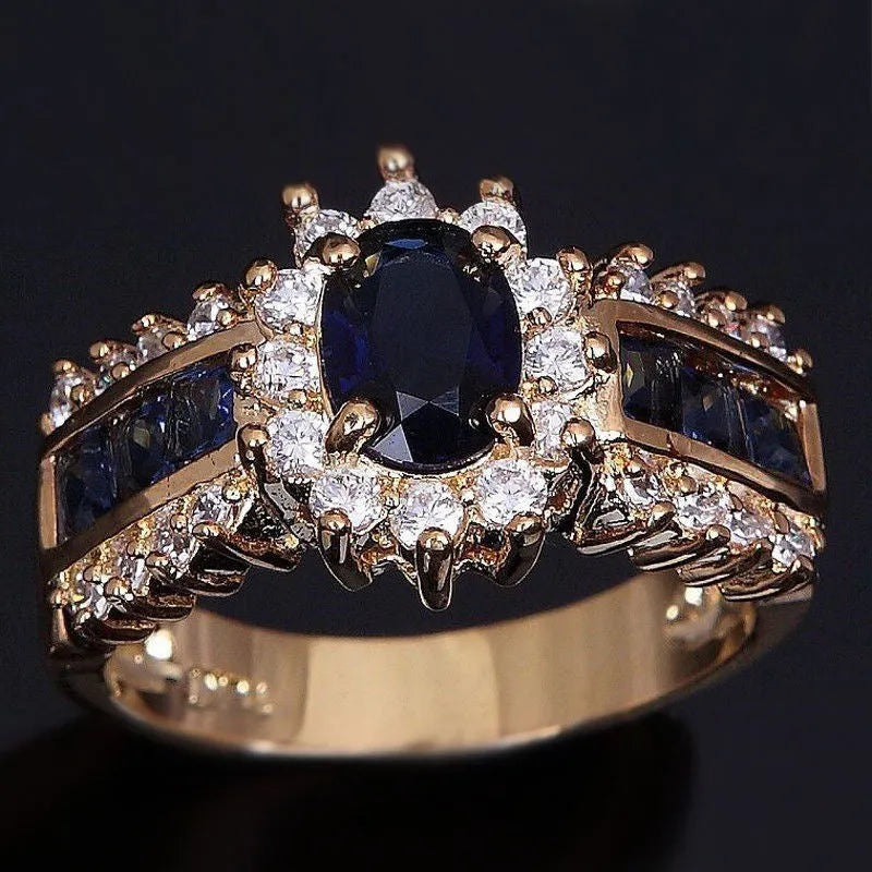 Personalised zinc alloy fashion ring with diamond and blue or purple zircon stone designs.