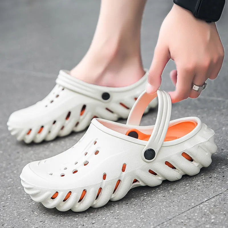 Men's beige hollow-out EVA slipper sandals with non-slip sole on a white background.