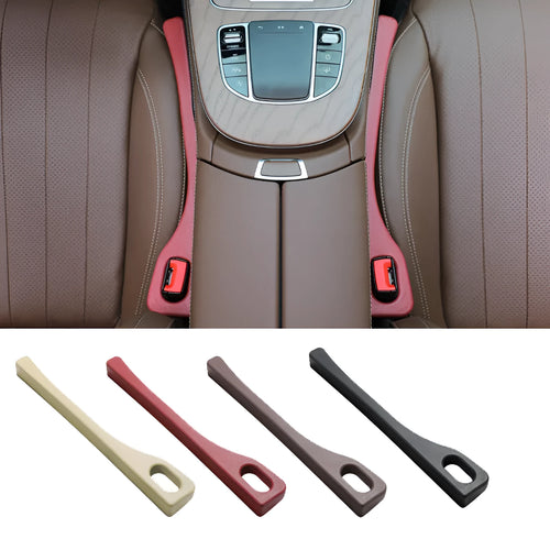 A flexible polyurethane car seat gap filler strip in black, placed between a car seat and centre console.