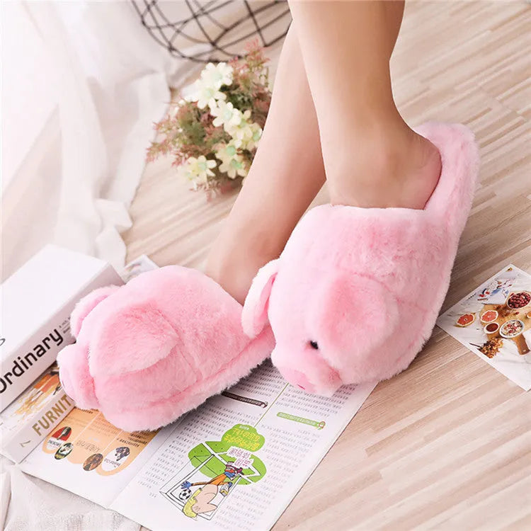 Pink plush pig slippers for adults with soft short fur and PP cotton filling on a white background.