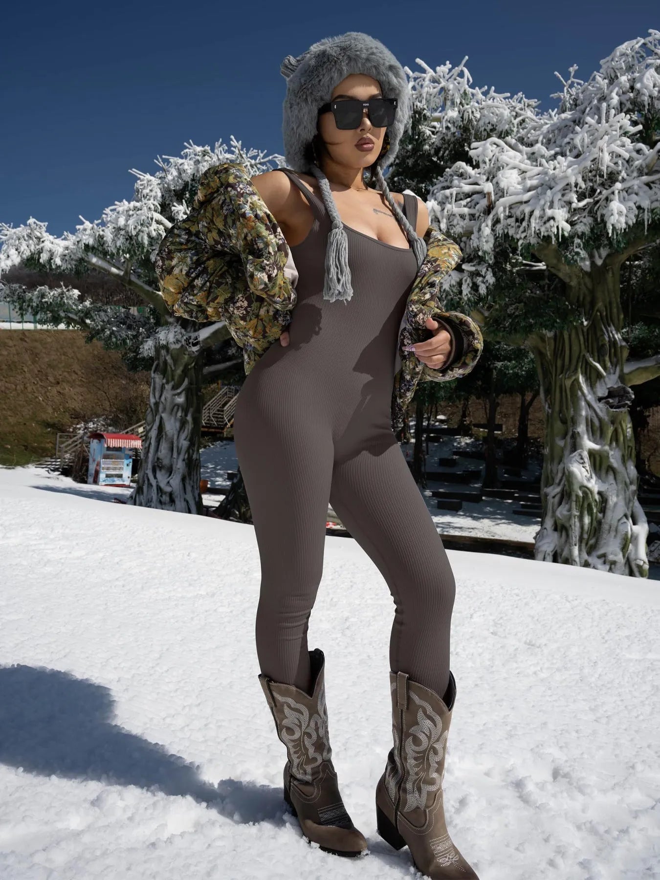 Women's beige suspender tank top tights with button detailing and long sleeves made from spandex fabric.