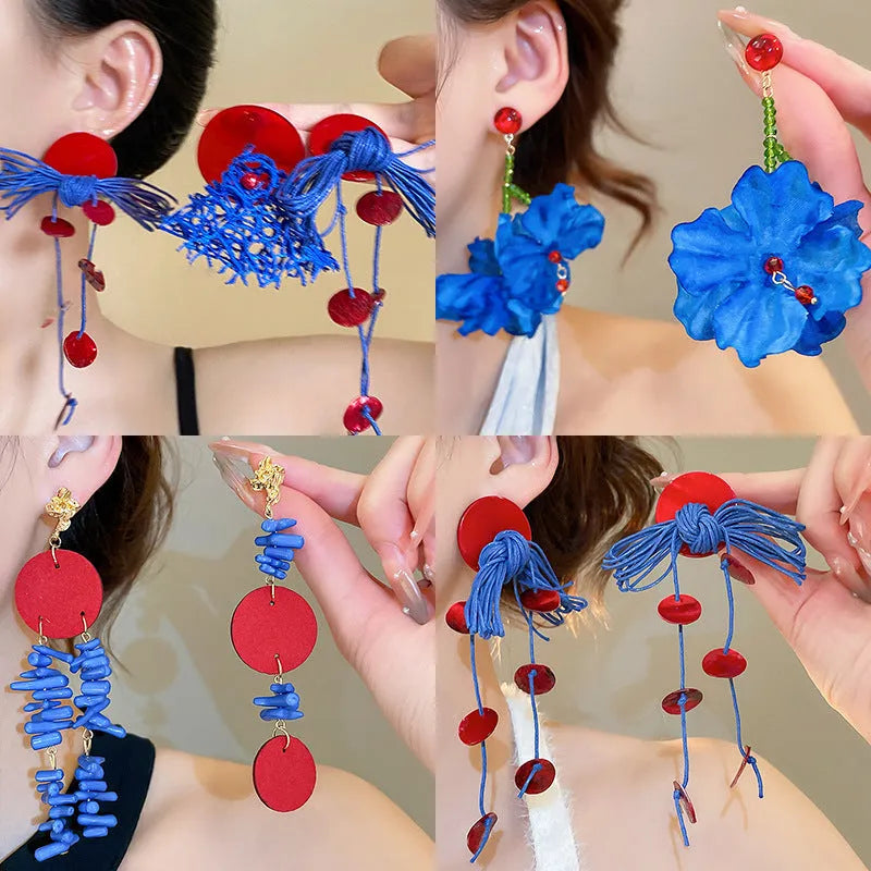 Women's geometric earrings with blue resin flower design on cloth material