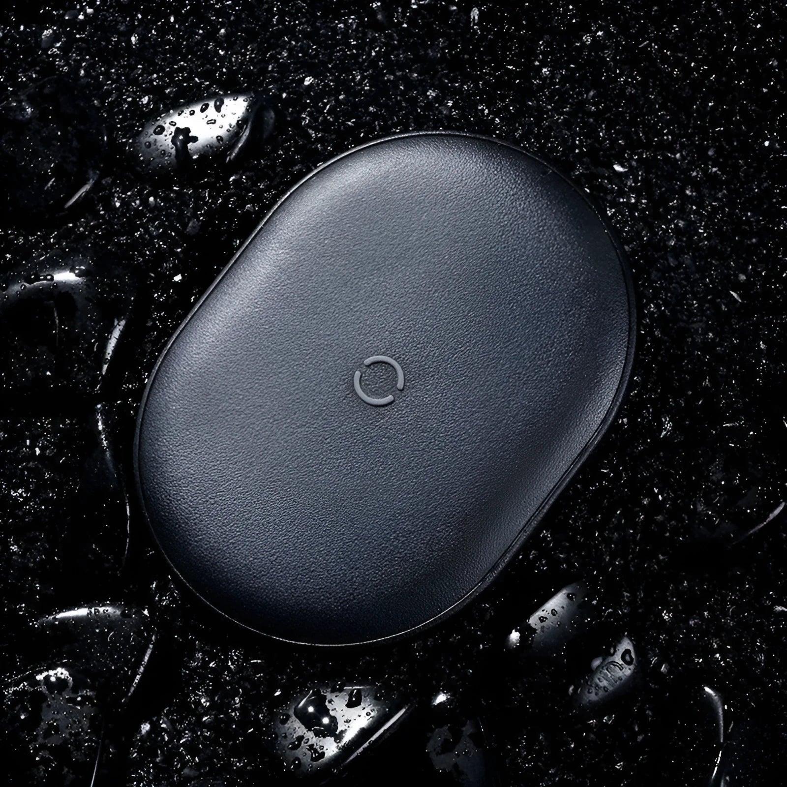 Baseus black wireless charging pad with phone positioned on charging surface