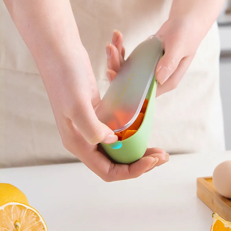 Green kitchen peeler with storage tube, stainless steel blade and hanging hole on handle