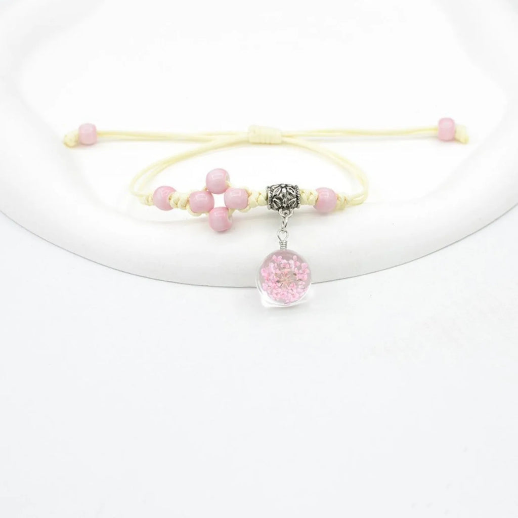 Glass dried flower bracelet with large 1.4 cm beads containing real preserved flowers in hand-woven lace design