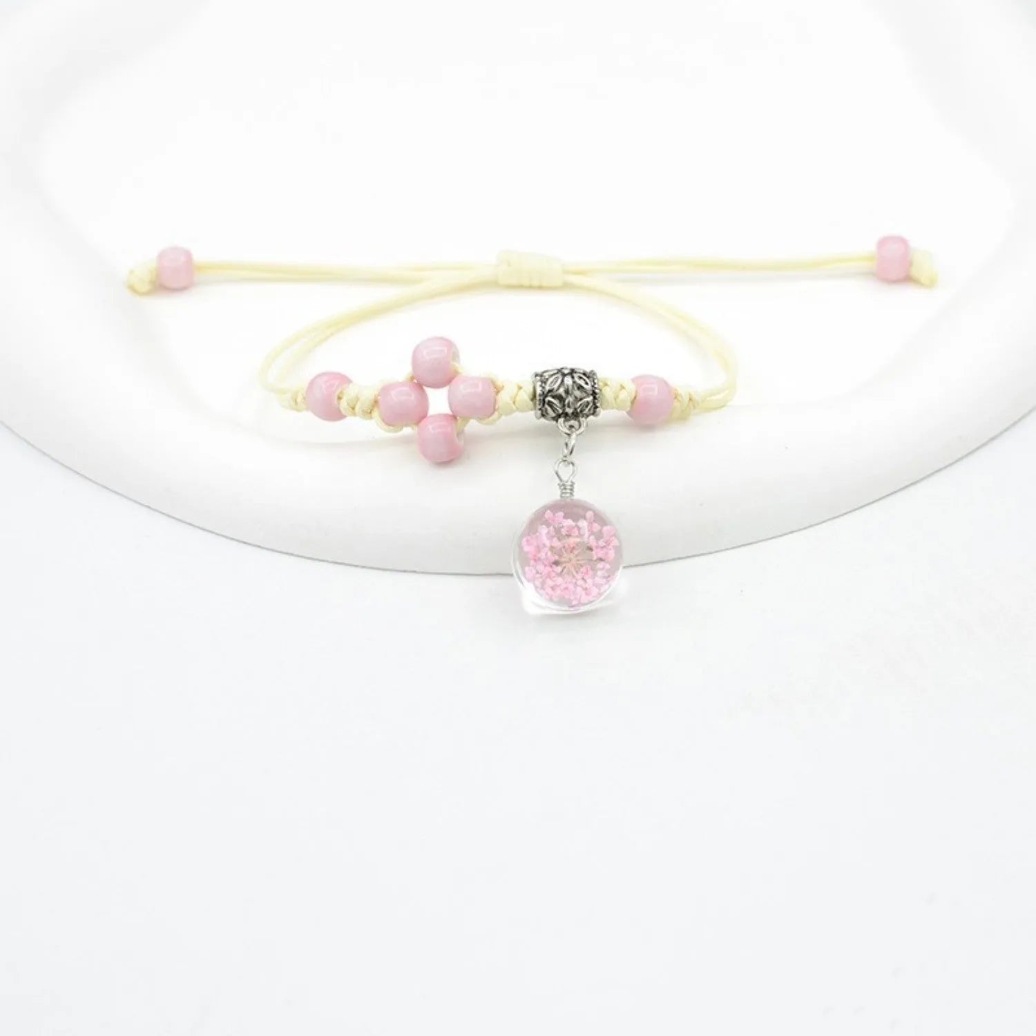Glass dried flower bracelet with large 1.4 cm beads containing real preserved flowers in hand-woven lace design