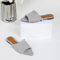 Women's denim casual flat slippers with a tassel detail in multiple colour options.