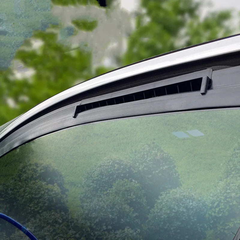 Black and white USB-powered car ventilation fan with 1.5 metre cable on a dashboard.