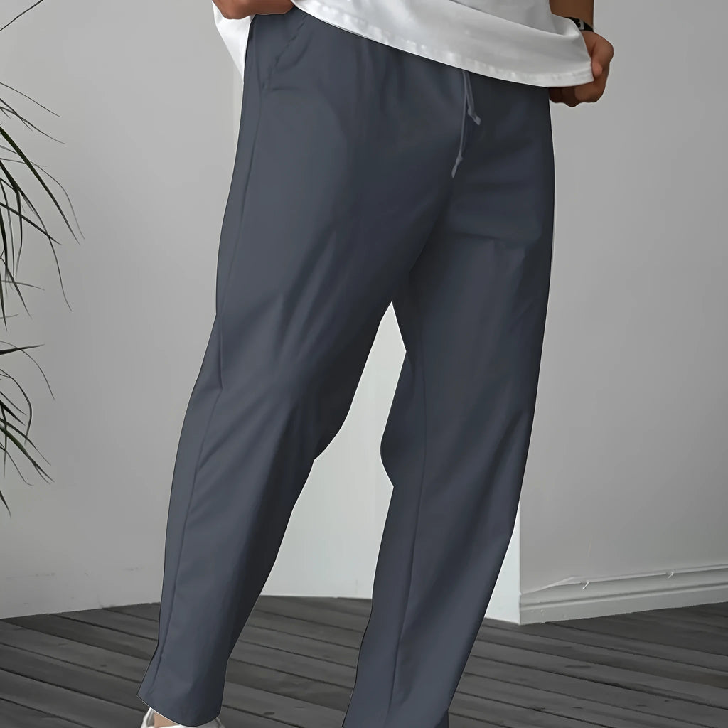 Men's khaki straight-leg drawstring casual trousers with a ribbon pocket detail.