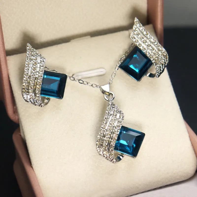 Women's alloy and glass cross chain necklace with matching electroplated ear studs set