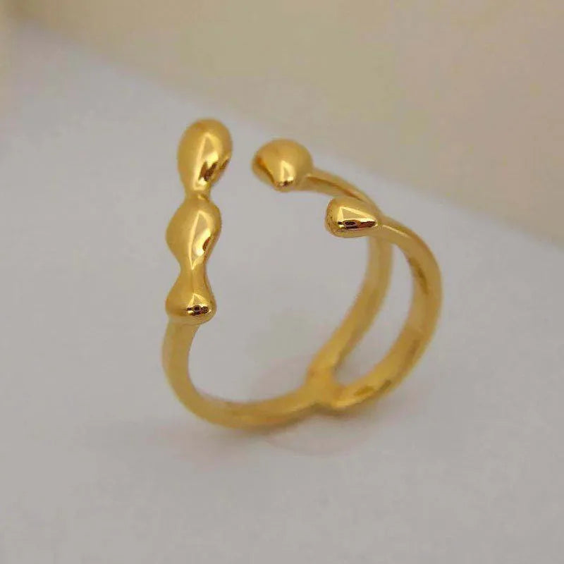 Brass fashion ring with spherical design in gold or silver colour for women's jewellery