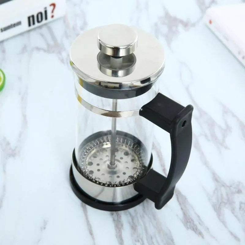 Compact glass and stainless steel cold brew coffee maker with 350ml capacity.
