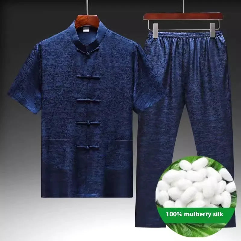 Man wearing a light green mulberry silk Chinese Tang suit, showing traditional woven silk construction.