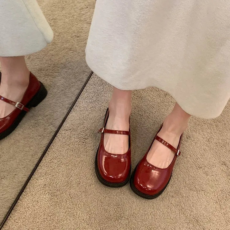 Women's red French vintage flat shoes with round toe and solid colour PU upper.
