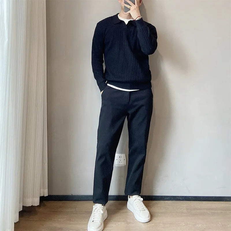 Man wearing a loose grey rabbit fur blend knitted pullover sweater, casual autumn style.